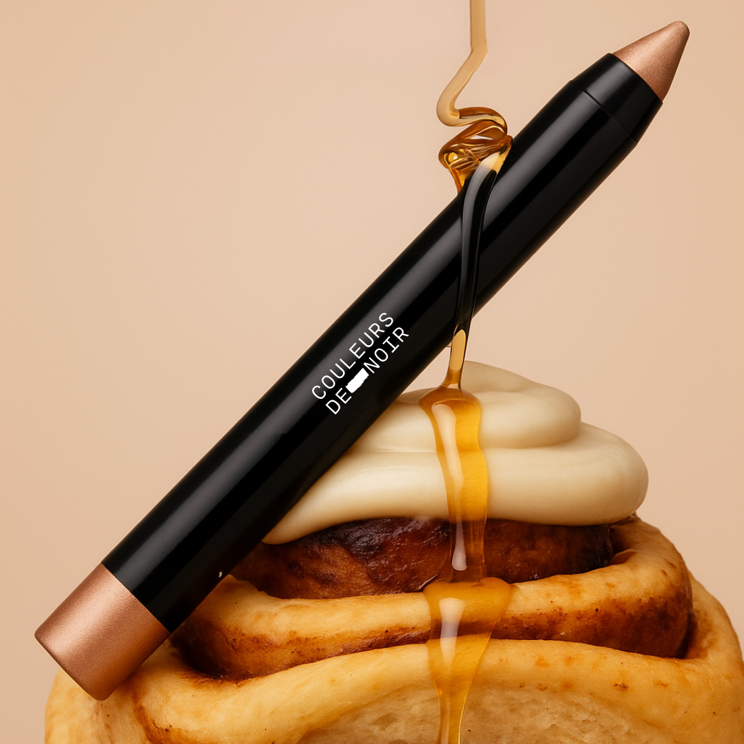 Makeup product with syrup dripping over a pastry on a beige background