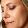 Close-up of a woman's face with a neutral expression